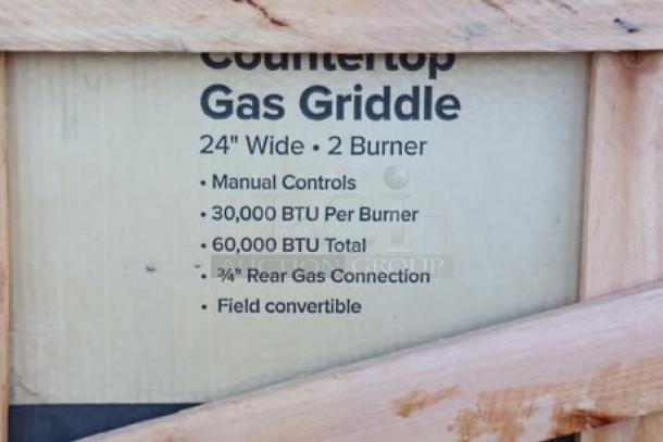 Brand new Avantco Chef Series CAG-24-MG 24" gas griddle, 60,000 BTU, manual controls; packaging damaged, possible scratches and dents.