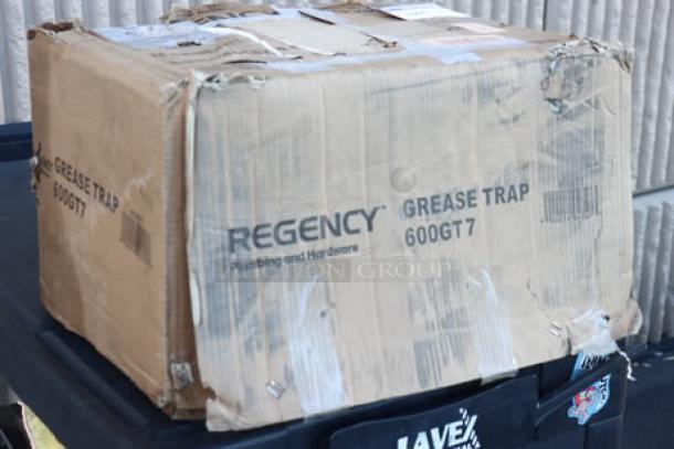 Brand new Regency grease trap, model 600GT7, in damaged packaging; may have scratches and dents.