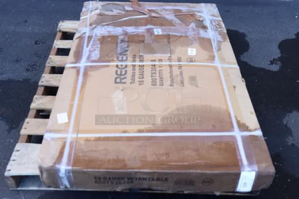 Regency 600TS3048S 30"x48" stainless steel work table in damaged packaging; potential scratches and dents noted.