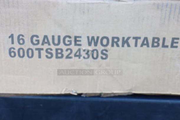Regency 600TSB2430S work table packaging, labeled "16 Gauge Worktable." Box shows signs of damage.