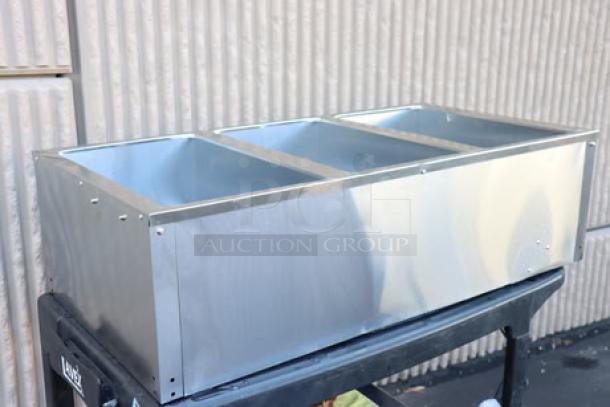Brand new Avantco STE-3S three pan open well electric steam table with undershelf, 120V, 1500W, minor scratches visible.