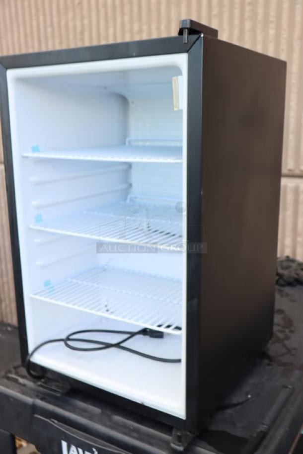 Galaxy CRG-3 black countertop refrigerated merchandiser, 2.5 cu ft, with shelves, minor cosmetic dent, power cord visible.