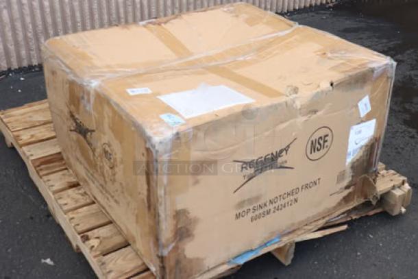 Damaged box containing Regency 16-gauge stainless steel mop sink, model 600SM242412N, with potential scratches and dents.