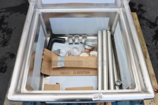 Brand new Regency 600S12323 28" stainless steel sink with visible parts. No drainboards. Out of box, possible scratches/dents.