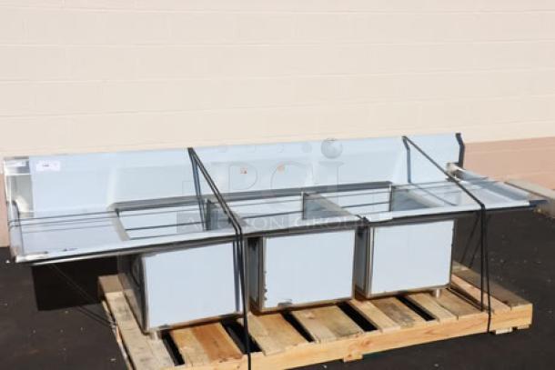 Regency stainless steel three-compartment commercial sink, model 600S31824218, brand new, with minor scratches/dents.