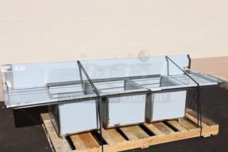 Regency stainless steel three-compartment commercial sink, model 600S31824218, brand new, with minor scratches/dents.