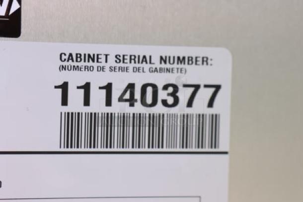 Barcoded tag showing the cabinet serial number, "11140377," for True STG2R-2S-HC refrigerator.