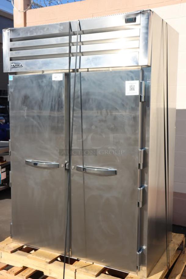 Brand new True STG2R-2S-HC refrigerator, scratch-n-dent, solid doors, PVC-coated shelves, commercial casters, 115V, S/N: 11140377.