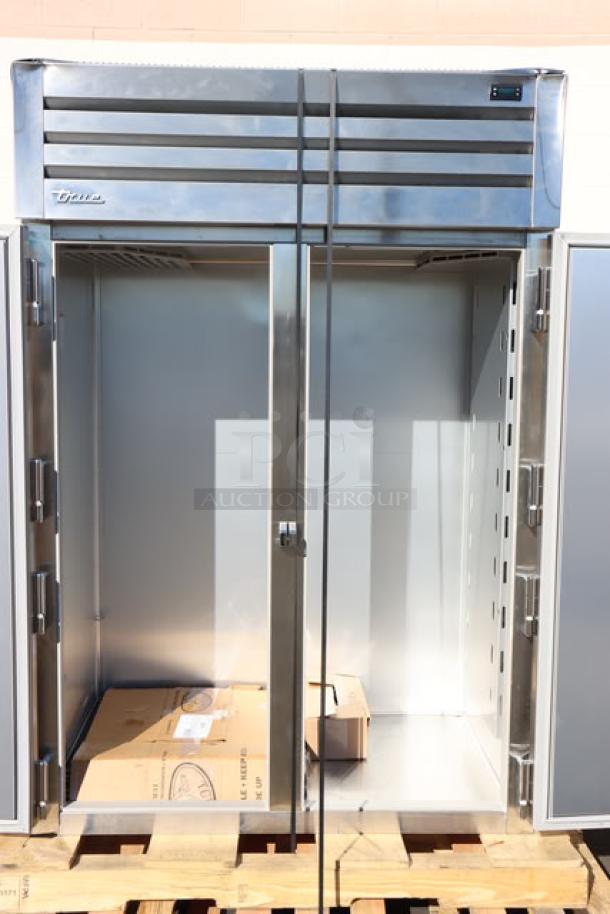 Brand new True STG2R-2S-HC refrigerator, scratch-n-dent, two solid doors, PVC-coated shelves, commercial casters, 52 5/8".