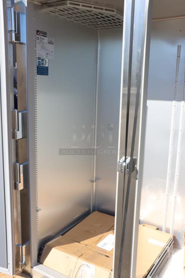 Brand new True STG2R-2S-HC refrigerator, 52 5/8" solid doors, PVC-coated wire shelves, commercial casters, scratch-n-dent condition.