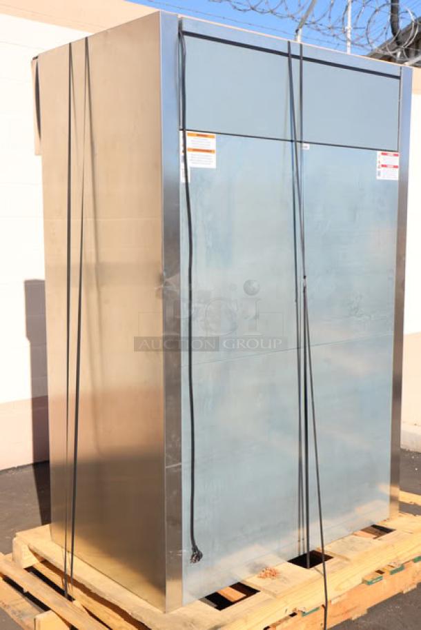 Brand new True STG2R-2S-HC reach-in refrigerator, solid doors, heavy-duty PVC-coated wire shelves, commercial casters, minor scratches.