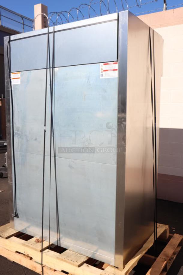 Brand new True STG2R-2S-HC solid door reach-in refrigerator with heavy-duty PVC-coated wire shelves, commercial casters, and minor scratches.