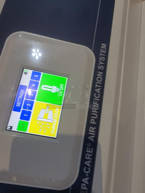 Abatement Technologies HC800FUV air purifier display screen showing settings and filter status.