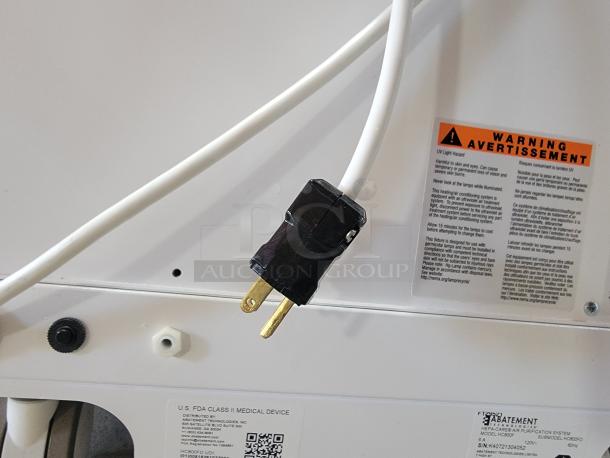 Abatement Technologies HC800FUV air purifier with visible power cord and safety warning labels, designed for medical-grade air quality.