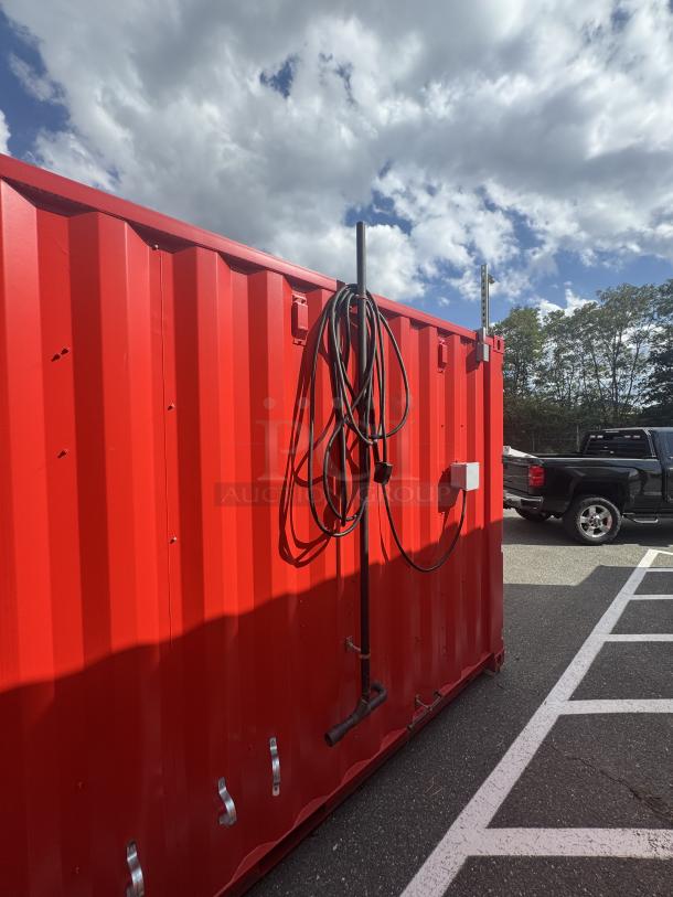 Red 20' mobile container with coiled cables on the side, shown outdoors. Features are not visible in this view.