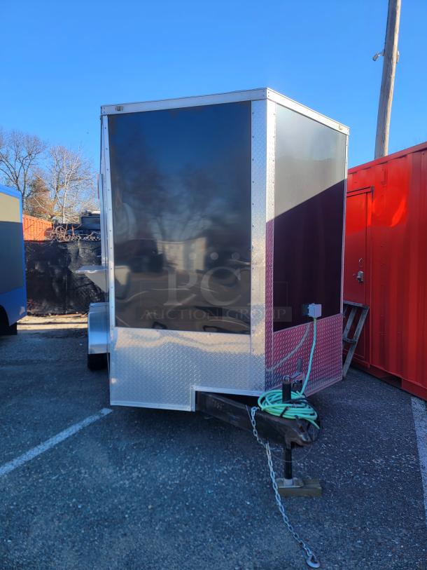 2021 Covered Wagon 16' Mobile Food Trailer with full commercial kitchen, non-slip floors, and side serving window.