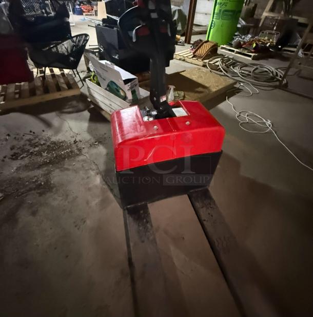 Dayton 55PD64 Electric Pallet Jack, 3,300lb capacity, non-working, charging issue, 546 hours, red and black, repair needed.