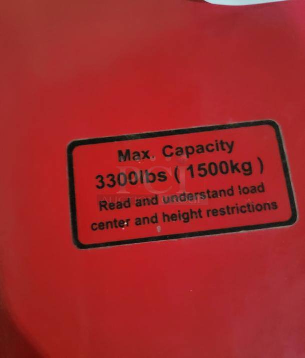 Dayton 55PD64 Electric Pallet Jack label showing max capacity 3,300lbs (1,500kg), note on load and height restrictions.