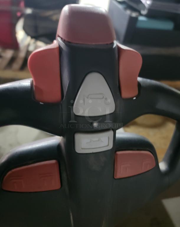 Dayton 55PD64 electric pallet jack handle, showing control buttons. Currently non-working due to charging issue. 3,300lb capacity.