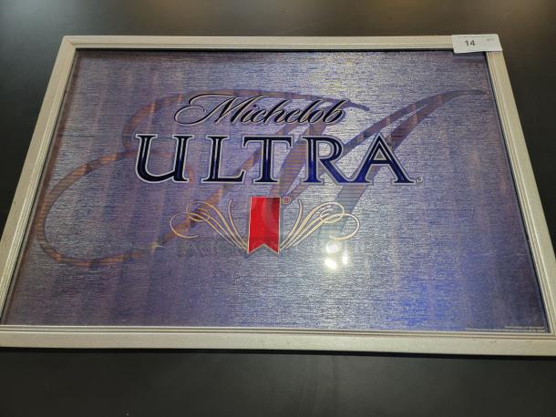 Large Michelob ULTRA bar mirror, 38"x26" with blue textured background, red ribbon logo, silver frame in great condition.