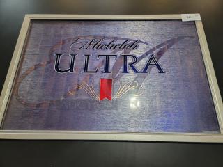 Large Michelob ULTRA bar mirror, 38"x26" with blue textured background, red ribbon logo, silver frame in great condition.