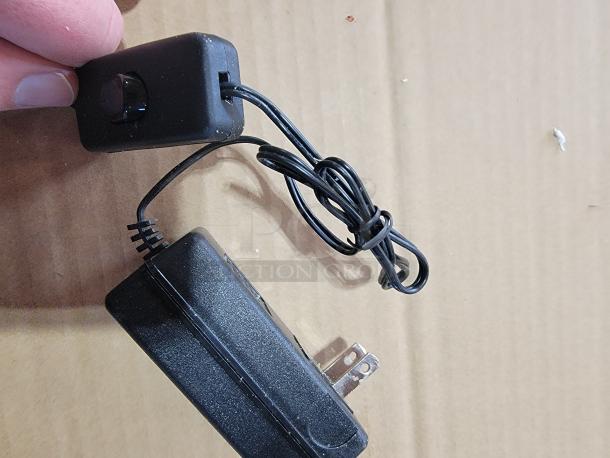 Power adapter and dimmer switch for Bud Light NFL LED Backlit Sign, showing cord, plug, and control components.