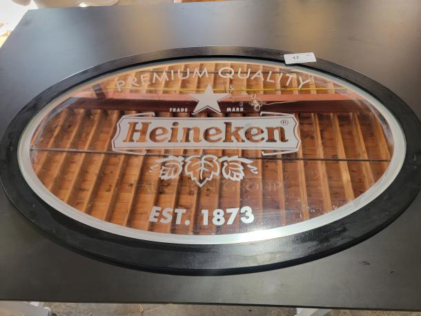 Vintage Heineken mirror, 47"x32", oval shape, features red star, "Est. 1873" branding, ideal for home bars.
