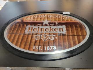 Vintage Heineken mirror, 47"x32", oval shape, features red star, "Est. 1873" branding, ideal for home bars.
