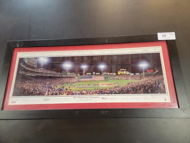 Framed 43.5" x 20" panoramic of 2007 Red Sox World Series by Rob Arra. Includes printed signatures, black frame, red matting.