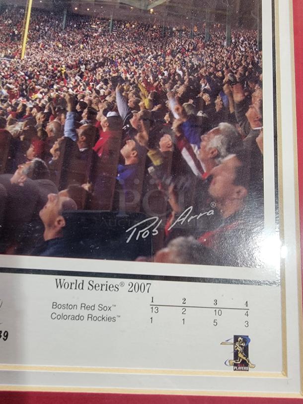 Framed 2007 Red Sox World Series panoramic by Rob Arra, 43.5" x 20", featuring printed signatures, matted in red.
