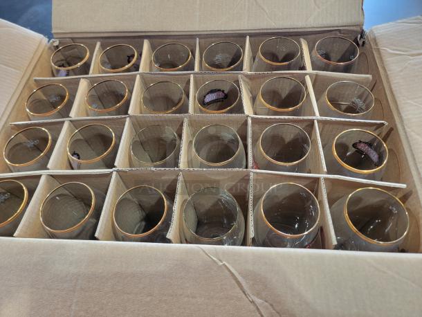 24-pack Stella Artois Belgium Chalices, 40cl each, featuring gold rims and star stems, in original packaging.