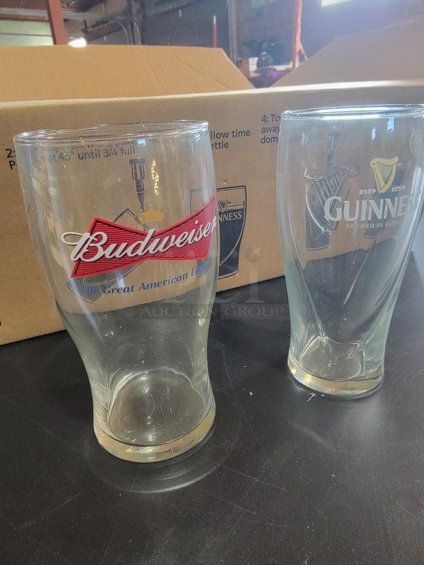 21-piece beer glass set: 14 Guinness glasses with harp, 7 Budweiser bowtie glasses. Great shape, perfect for collectors.