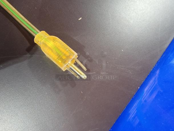 Plug for Bud Light 53" billiard lamp with transparent yellow casing, showcasing power functionality.