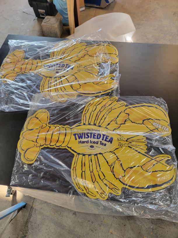 Set of 2 Twisted Tea metal lobster signs, brand new, 36"x25", embossed metal, vibrant yellow and blue branding.