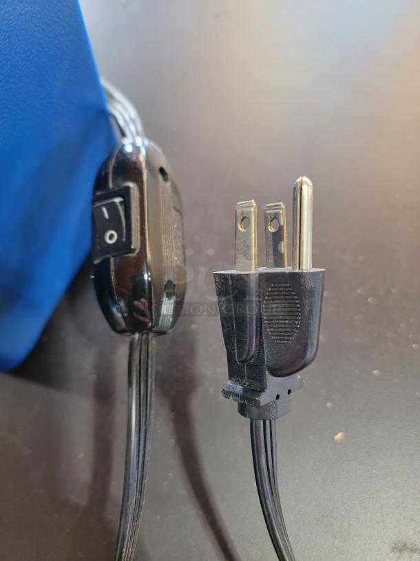 Close-up of a power switch and plug of a 2007 Miller Lite LED "Feature Ticker" sign. Static light working, ticker not working.