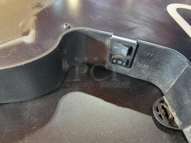 Close-up of the switch on a Bud Light NFL New England Patriots Neon Sign, showing "Bright" and "Dark" settings.