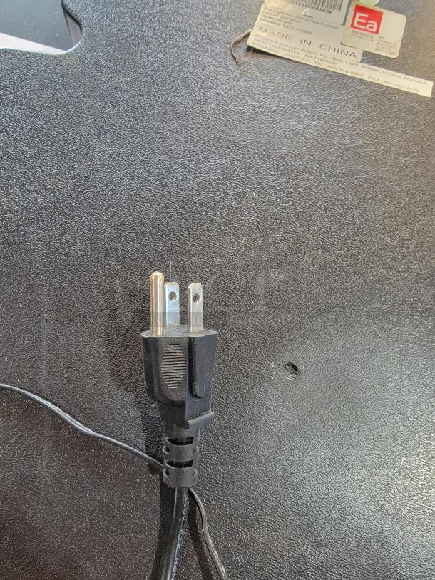 Back view of Bud Light NFL New England Patriots neon sign with a power plug and visible "Made in China" label.