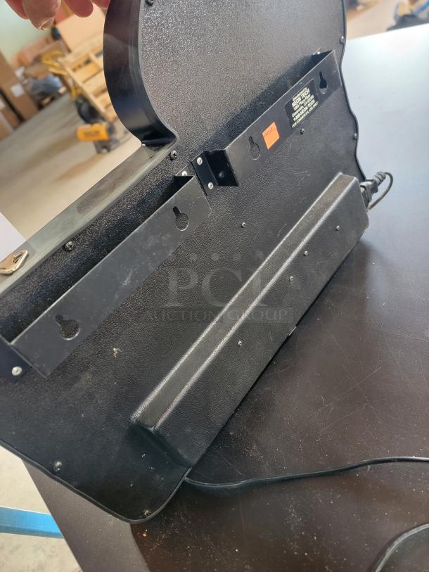 Rear view of Captain Morgan LED neon sign showing commercial-grade backing, keyhole slots, and Neon Tech manufacture label.