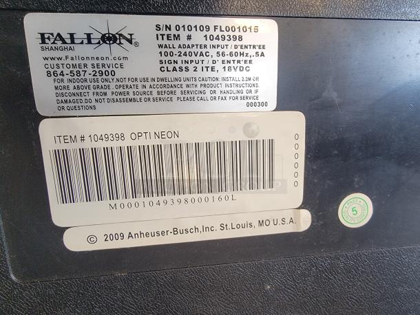 LED sign back showing labels for Fallon, "Opti Neon" model, and Anheuser-Busch, with serial and customer service info.
