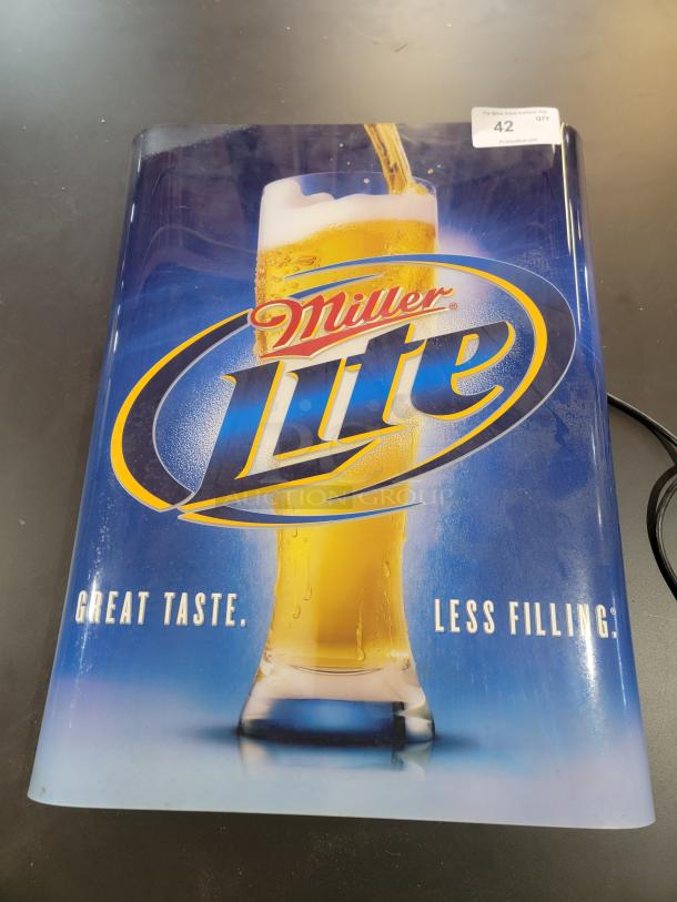 Vintage Miller Lite backlit bar sign from 2008, 3D design, 23" x 3" x 29". Lights non-functional, physical condition good.