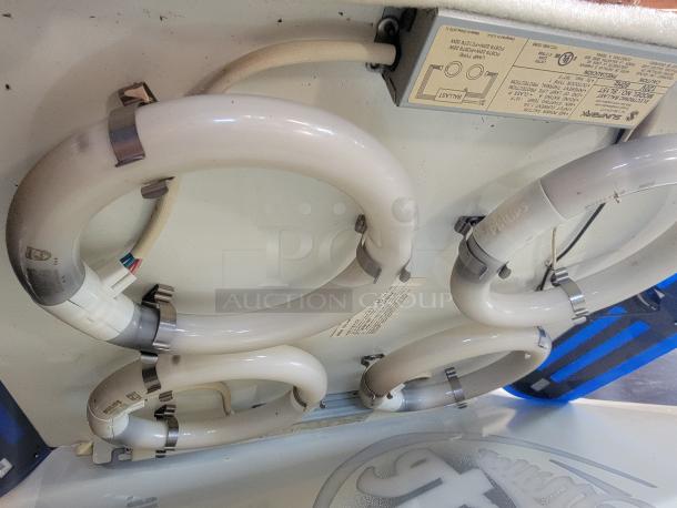 Vintage Miller Lite 2008 backlit bar sign, 23"x3"x29", with curved design and brewery graphics. Internal lights non-working.