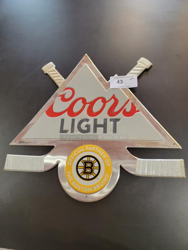 Rare Coors Light x Boston Bruins metal hockey sign, 24"x22", featuring Coors Light logo, crossed hockey sticks, and Bruins emblem.