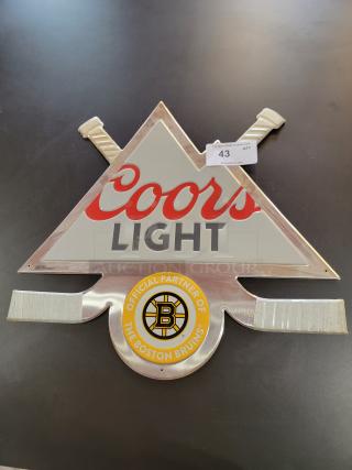 Rare Coors Light x Boston Bruins metal hockey sign, 24"x22", featuring Coors Light logo, crossed hockey sticks, and Bruins emblem.