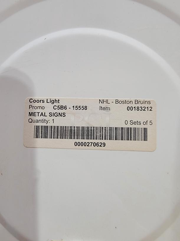 Coors Light x Boston Bruins metal hockey sign, 24"x22". Features Coors Light logo with crossed sticks and Bruins emblem. Promo label C5B6-15558.