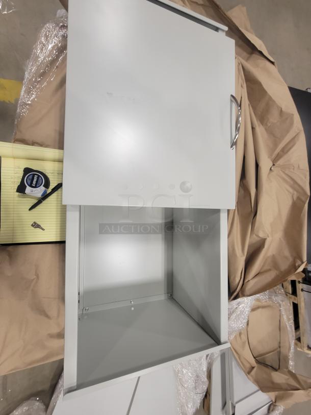 Set of 5 AIS Cubicles with glass tiles, like new, featuring motorized height-adjustable tables and lockable storage.