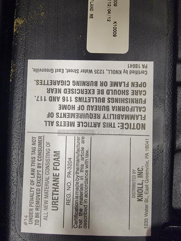 Label on Knoll ReGeneration chair base, showing urethane foam material and compliance note. Certified by Knoll, Inc.