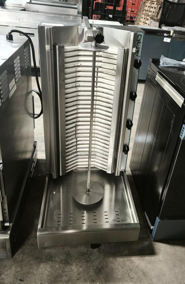 Brand new Visvardis DE4A 39" electric gyro machine, 140 lb. capacity. Stainless steel, vertical rotation, adjustable heat.