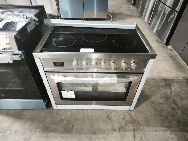 Brand new KoolMore 36-Inch Electric Range, model KM-FR36EE-SS, stainless steel, with smooth cooktop and control knobs.
