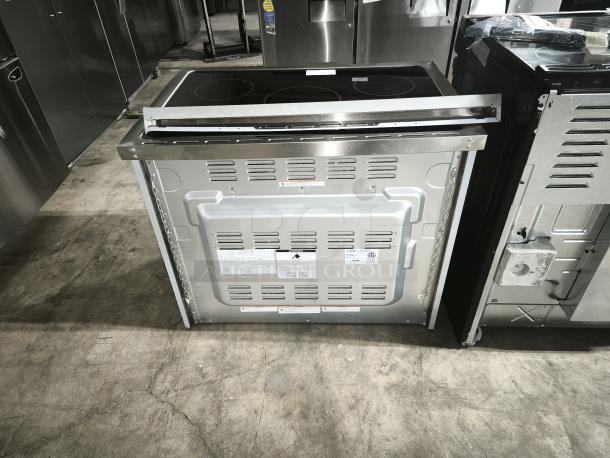 KoolMore 36-Inch all-electric range, model KM-FR36EE-SS, brand new, rear view with label tags visible.