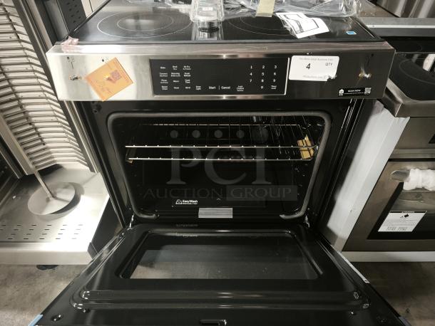 Brand new GE® 30" slide-in electric convection range, model GRS600AVFS, with Air Fry feature and EasyWash™ oven tray.